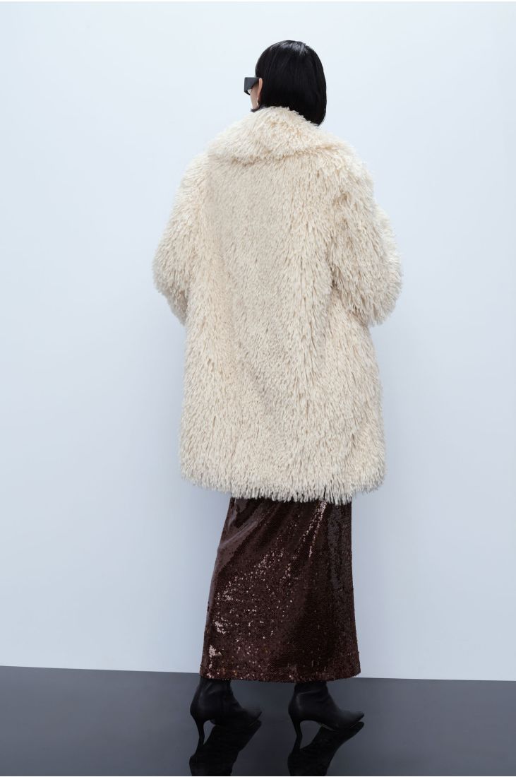 Voluminous faux fur coat with lapels