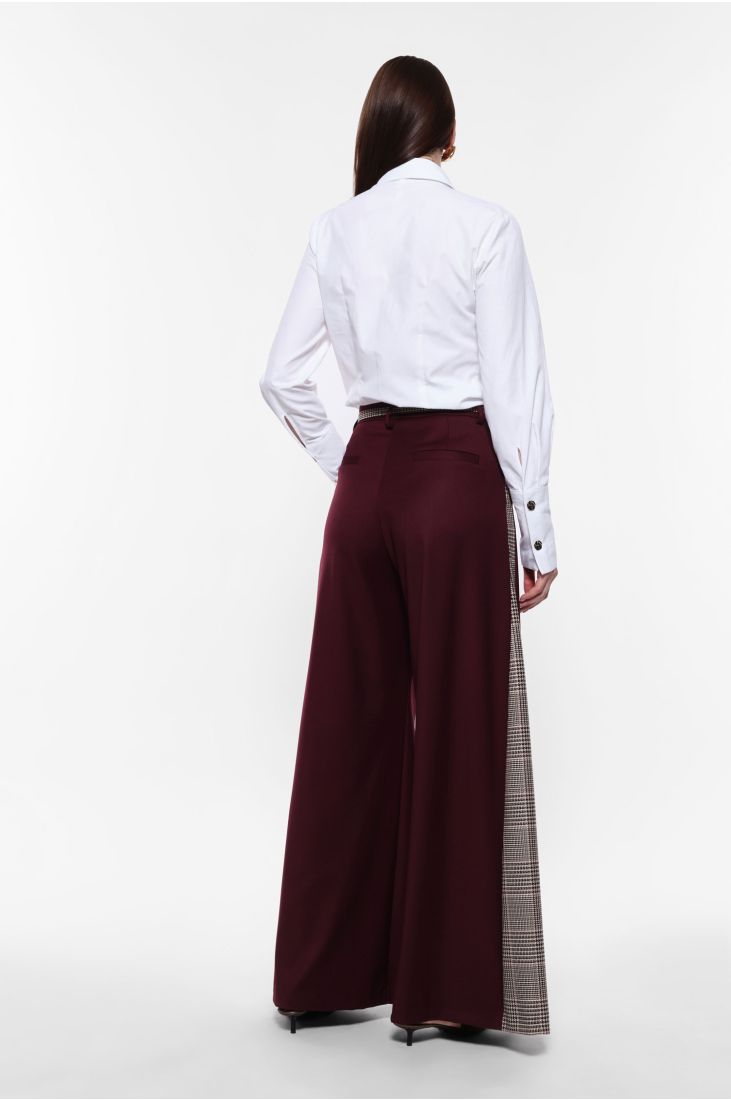 Wide trousers with houndstooth side stripes