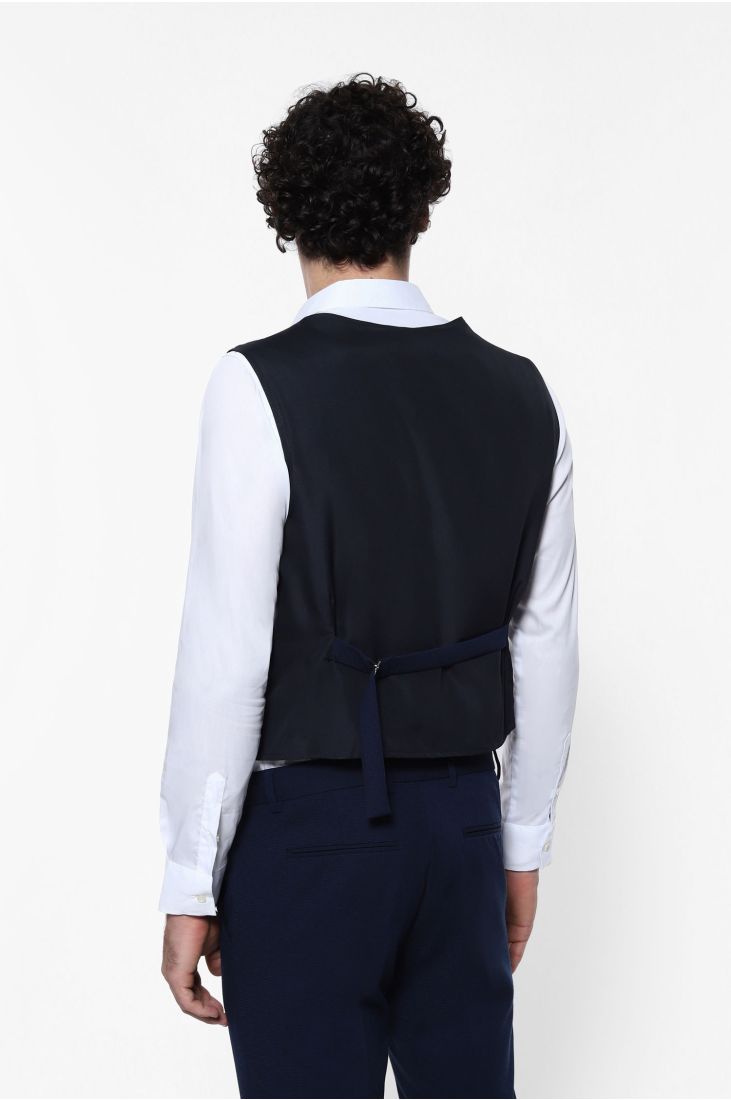 Vest with button closure