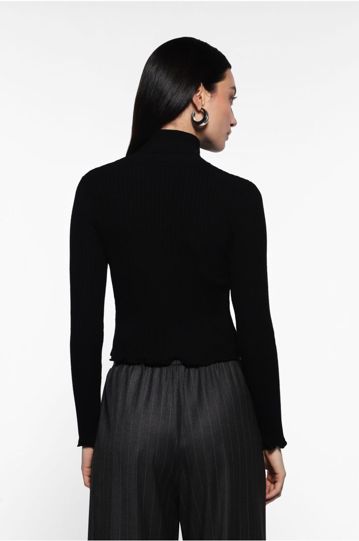 Turtleneck sweater with ruffled edges