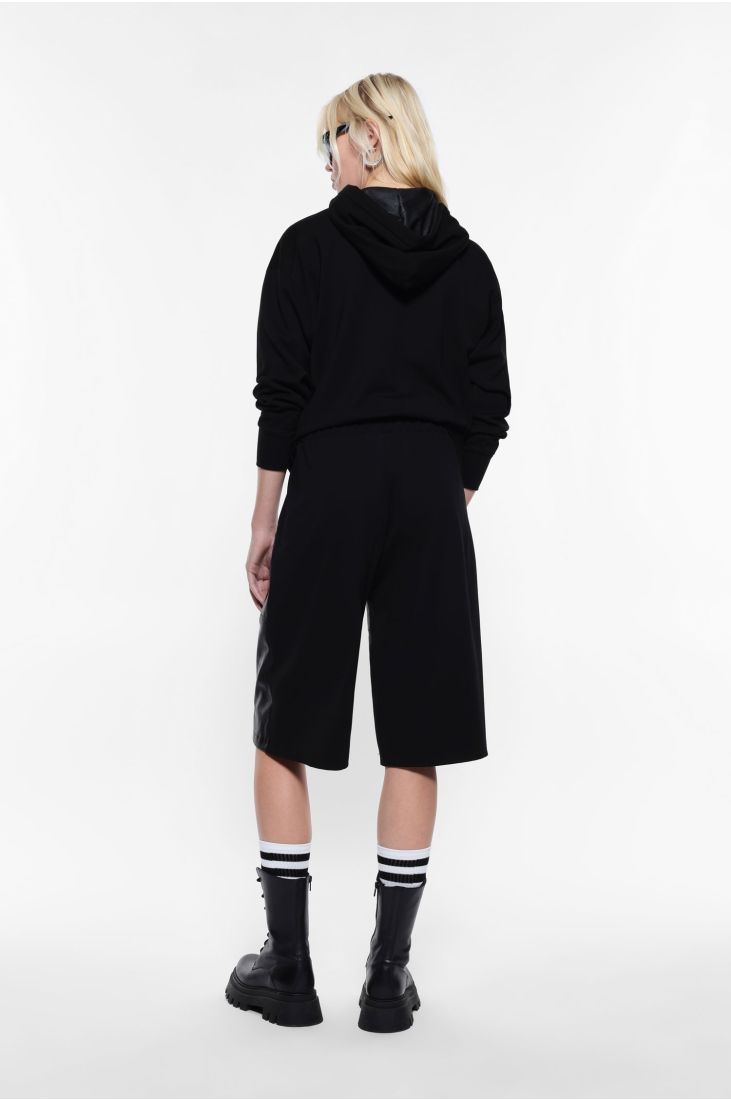 Knee-length shorts in faux leather and fabric