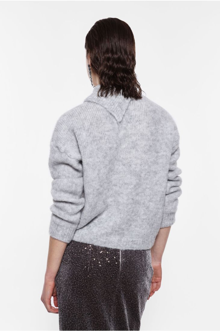 Sweater with asymmetrical collar and pin