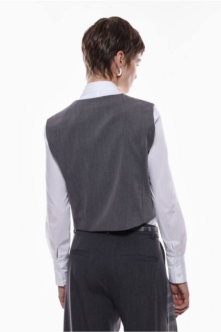 Vest with button fastening