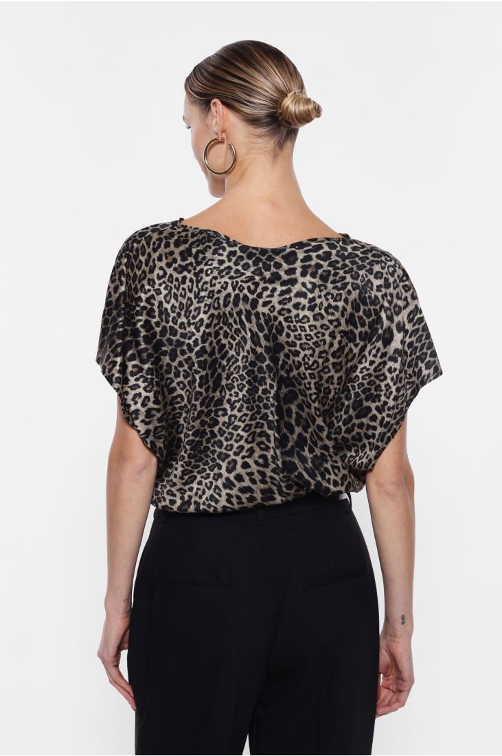 Animal print top with draped neckline and short sleeves